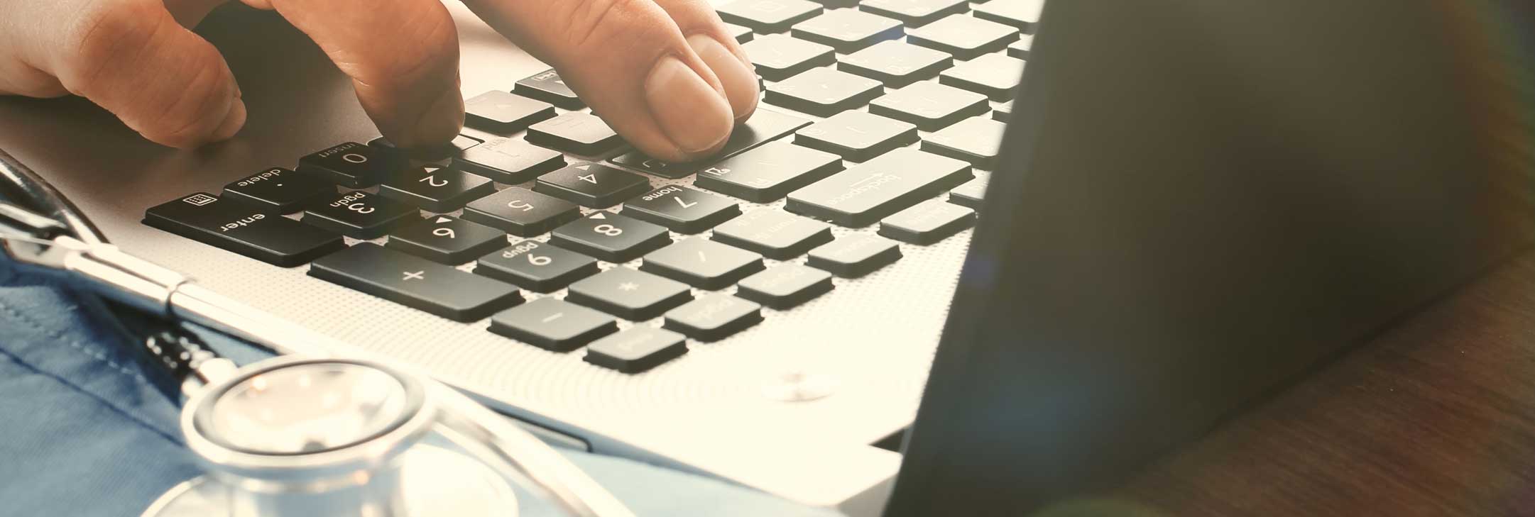 fingers on a computer keyboard