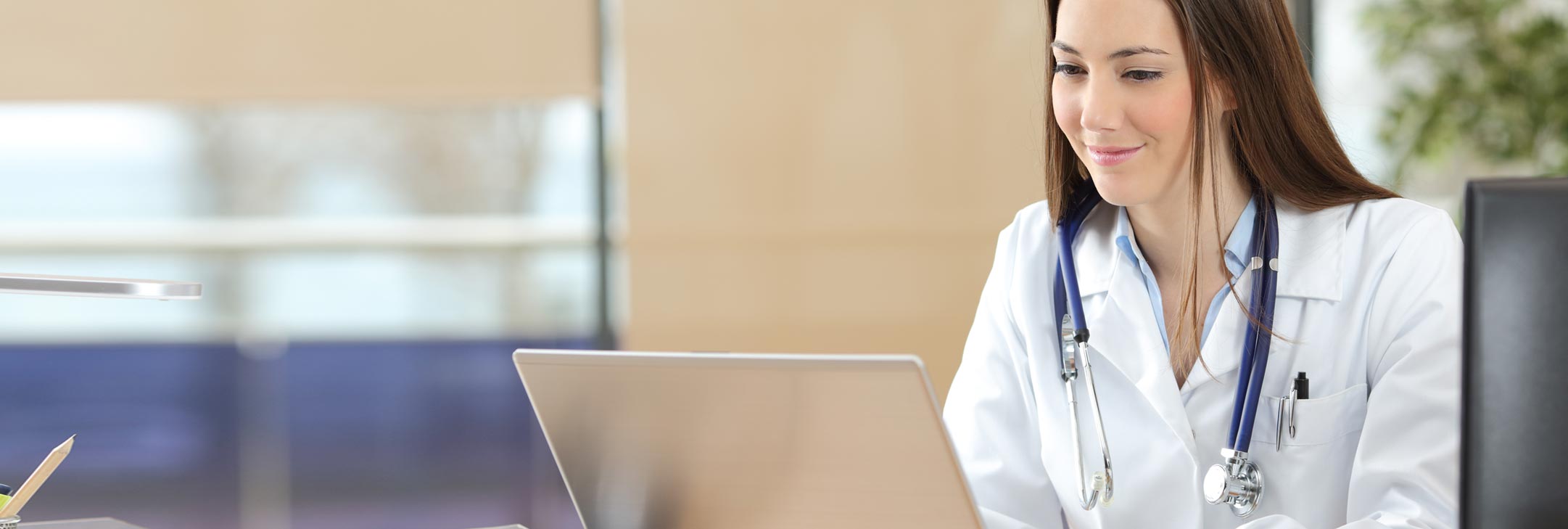 medical professional at a desk